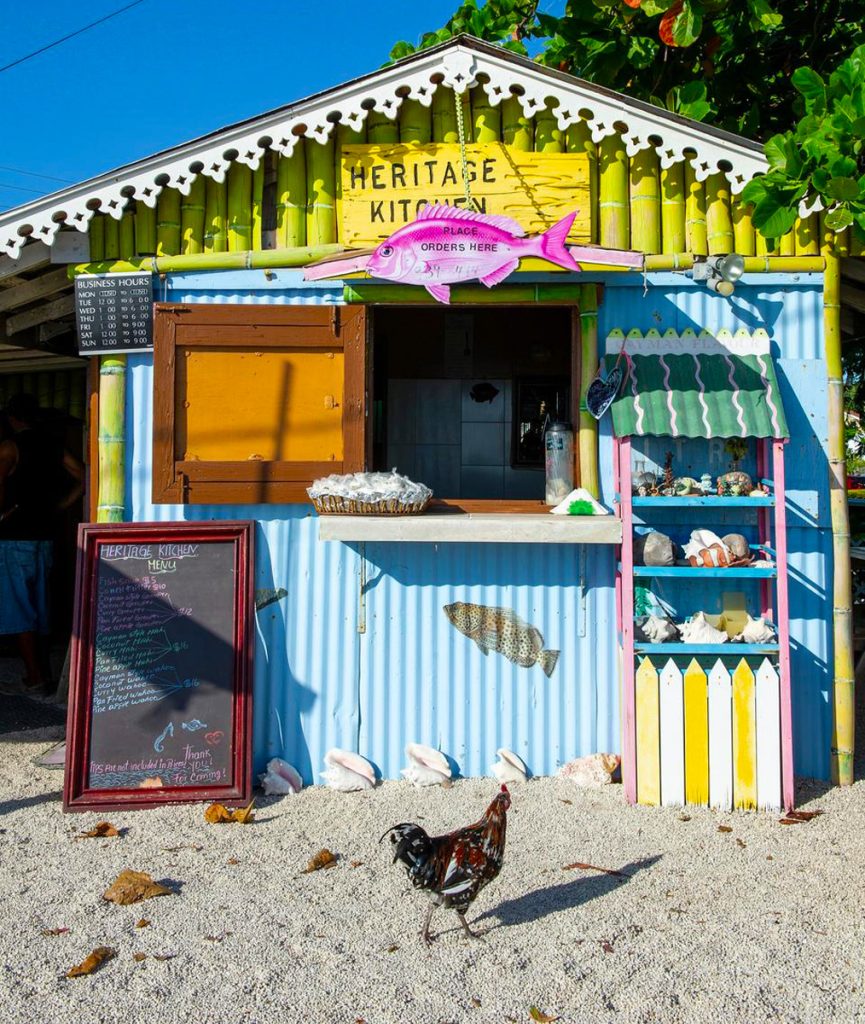 Heritage Kitchen, Grand Cayman — traditional Caymanian fried fish served with rice and beans, fried plantains, and garden salad by the seaside