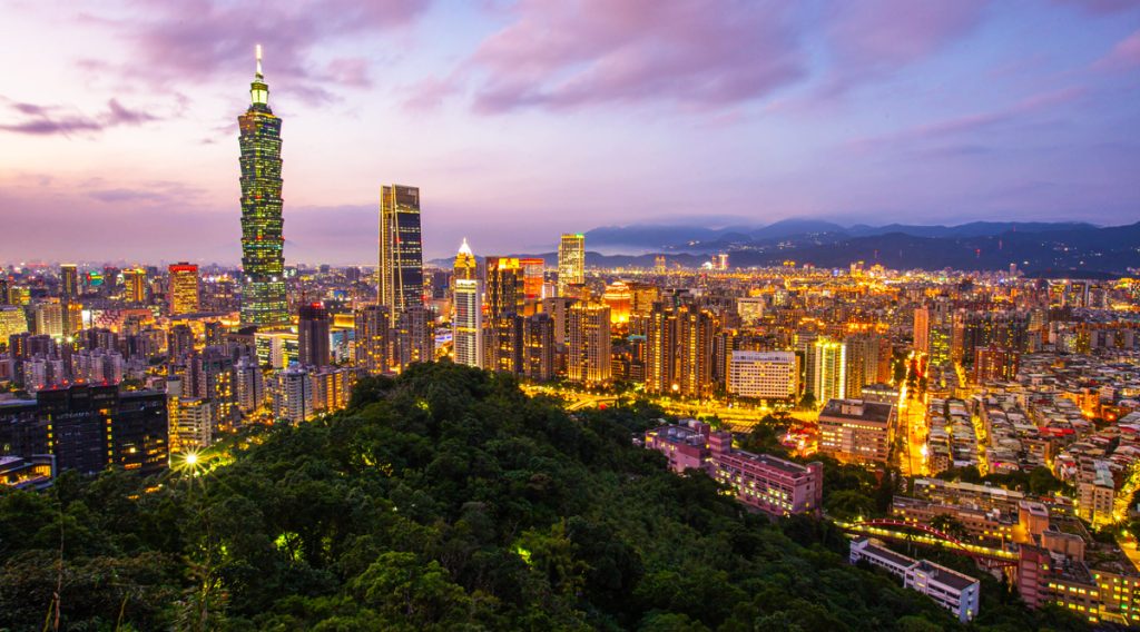 Taipei cityscape with modern skyscrapers and mountain backdrops