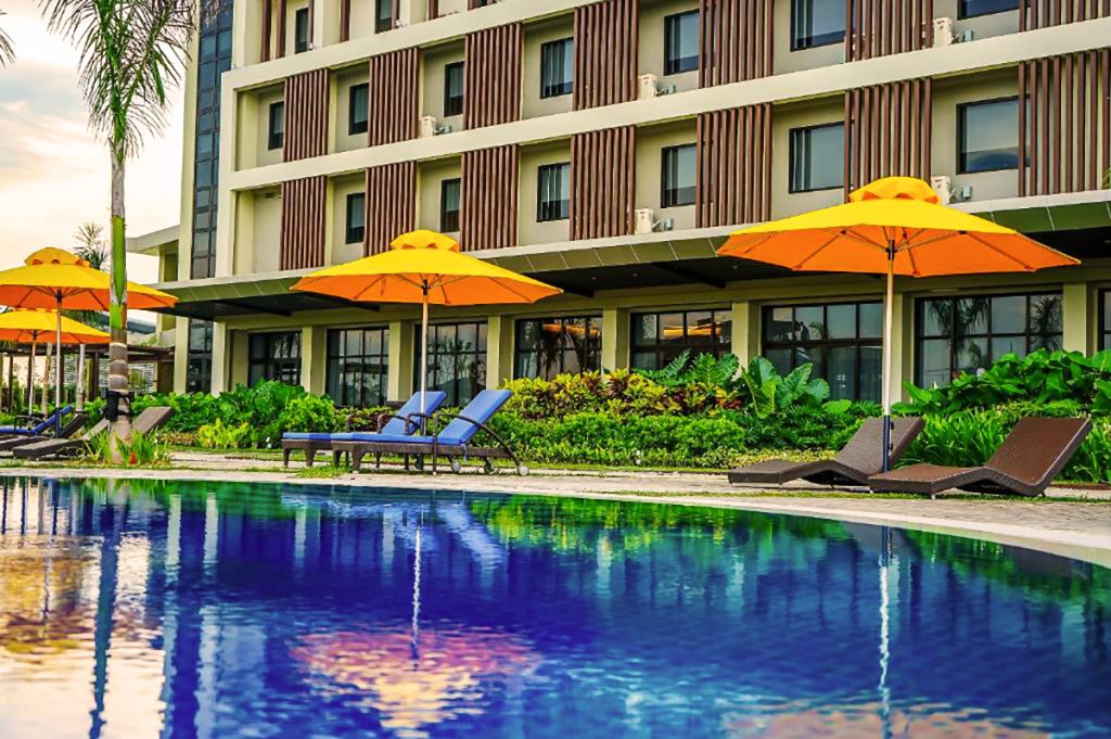 pool with cabana chairs