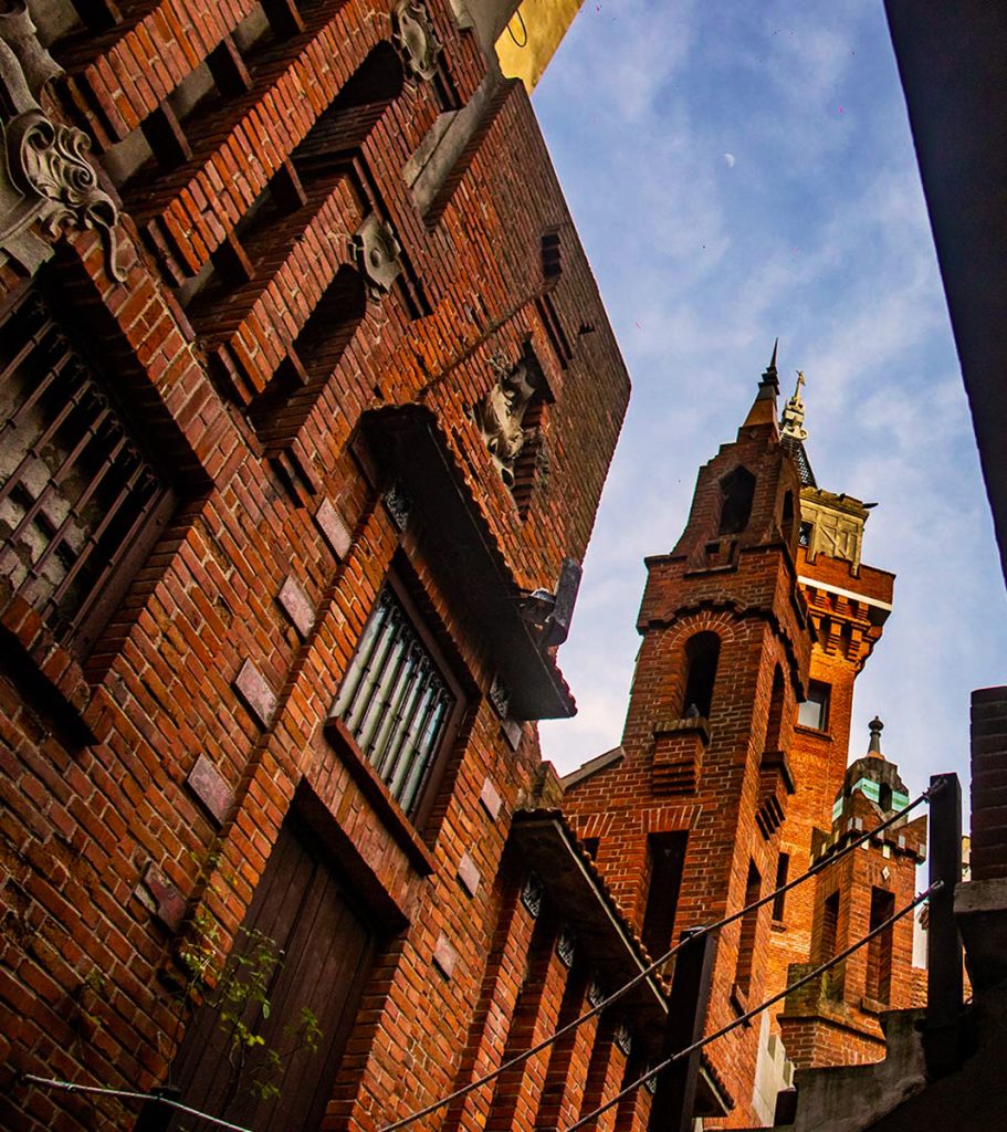 A mysterious, eclectic mansion filled with symbolic architecture and legends, perfect for a quirky visit.