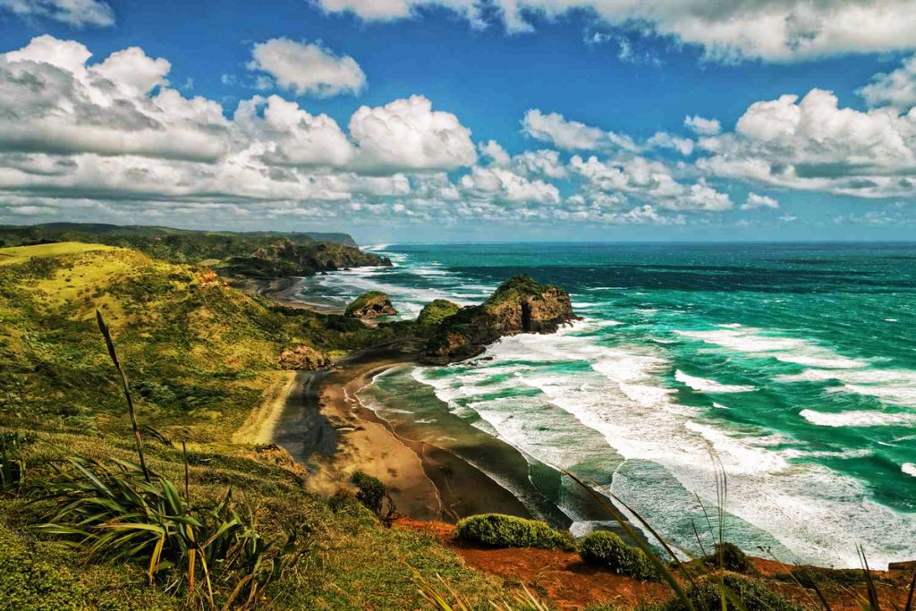 Waitākere Ranges – Rainforests, rugged coastlines, and black-sand surf beaches like Piha